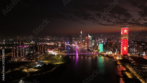 Obraz na płótnie Ho Chi Minh City, Vietnam: 4K Aerial Night Drone View of Skyline, Skyscrapers, T