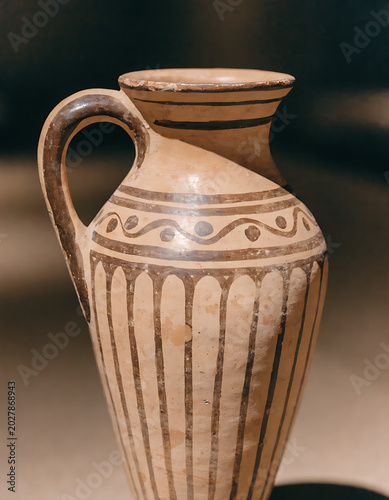 Handmade pottery mug with rope handle on table isolated on transparent background