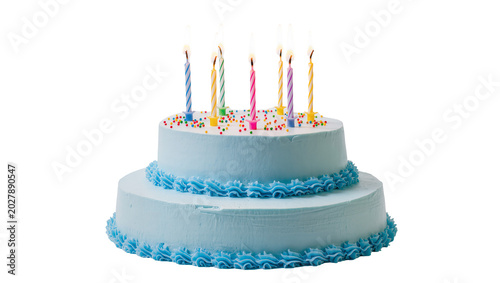Photography Two-tiered baby blue frosted cake with colorful candles and sprinkles, isolated