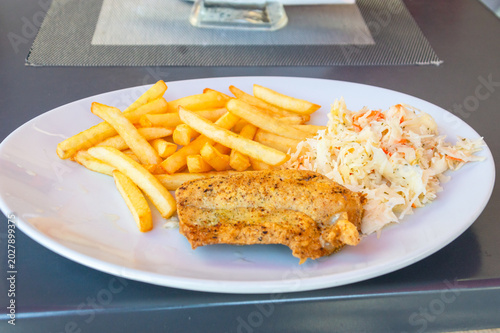 Cod with fries and salad.