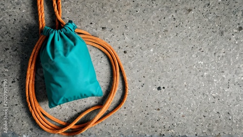Climbing Chalk Bag and Rope on Granite Texture