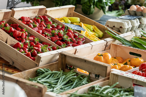 A vegetable stall with fresh farm vegetables at the market