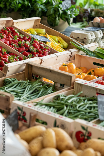 A vegetable stall with fresh farm vegetables at the market