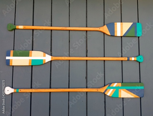 Konstfotografi Wooden canoe paddles on grey wall