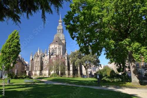 Saint Sauveur Basilica in Dinan, Brittany, Cotes d'Armor, France, viewed from a park and with spring colors