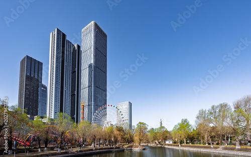 Changchun, China: Apricot Blossoms Amidst Skyscrapers and Amusement Park Scenery