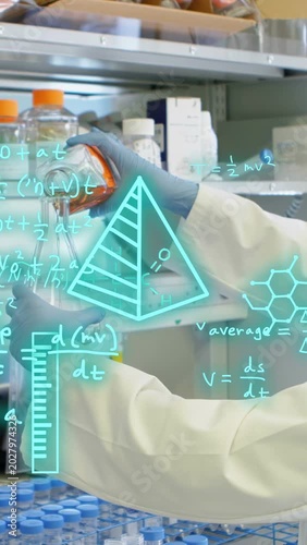 Vertical video: Tech pouring reagent between vials in lab, sparking cyan graphs growing for assay