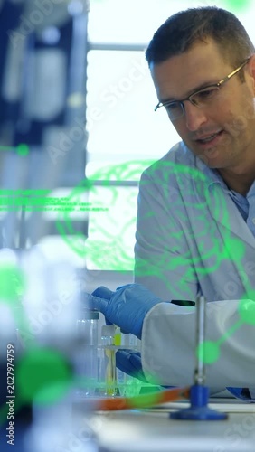 Vertical video: Lab tech leaning over rack pipetting yellow sample, peeking green overlay for test