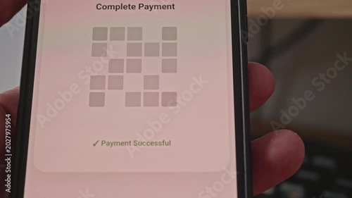 Hand holding a phone during a cryptocurrency transaction process with a loading animation.