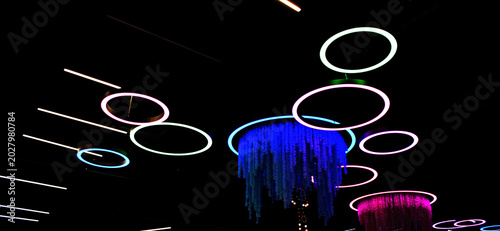 Photos Circles and straight lines of different colors glow brightly against a dark back