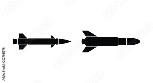 Schilderij op canvas Two black missile silhouettes with wings pointing to the right on a white backgr