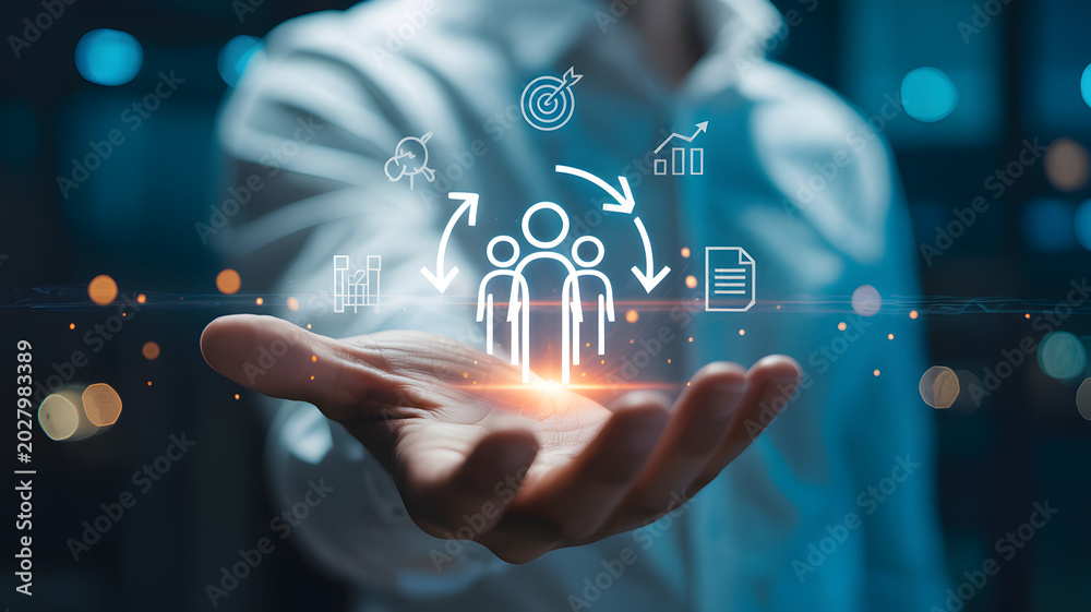Fototapeta premium Human resources management concept with digital icons floating above an outstretched hand in soft focus lighting