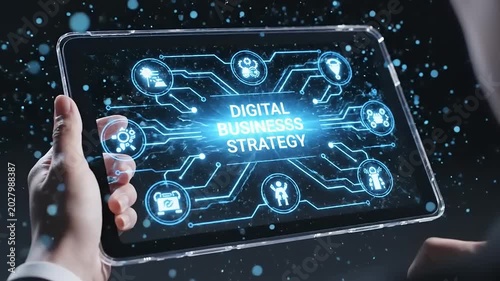 Businessman holding digital business strategy tablet.