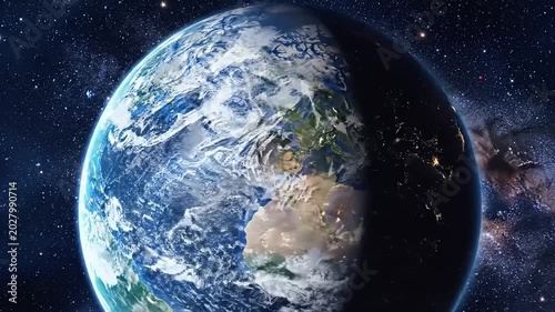 Earth from space with galaxy background.
