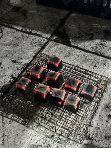 Fire burning from coconut charcoal briquette for business production	
