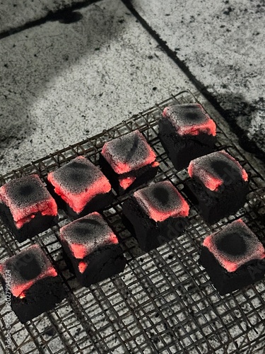 Fire burning from coconut charcoal briquette for business production	
