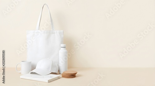 Modern white startup swag mockup with tote bag cap mug bottle notebook pen and coasters