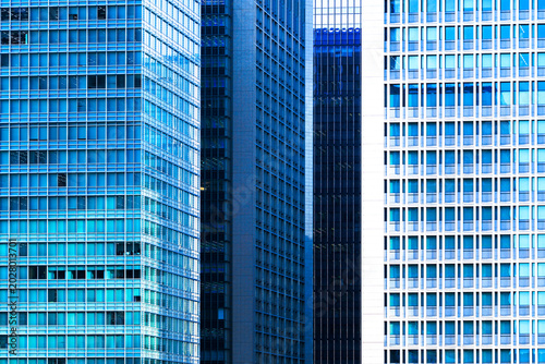 Abstract architectural layer effect of modern glass skyscrapers in Tokyo.