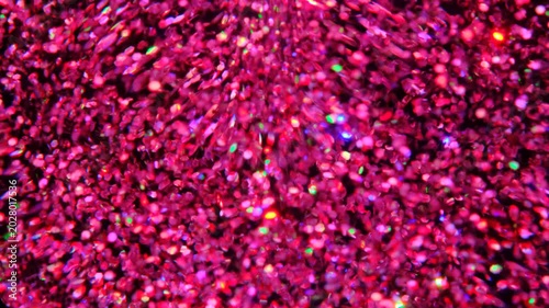 holographic Iridescent glitter particles background, showcasing a distinct shimmering texture with rainbow-colored light