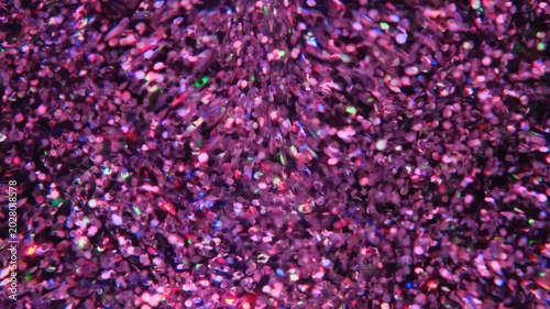 holographic Iridescent glitter particles background, showcasing a distinct shimmering texture with rainbow-colored light