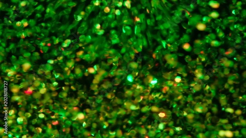 holographic Iridescent glitter particles background, showcasing a distinct shimmering texture with rainbow-colored light