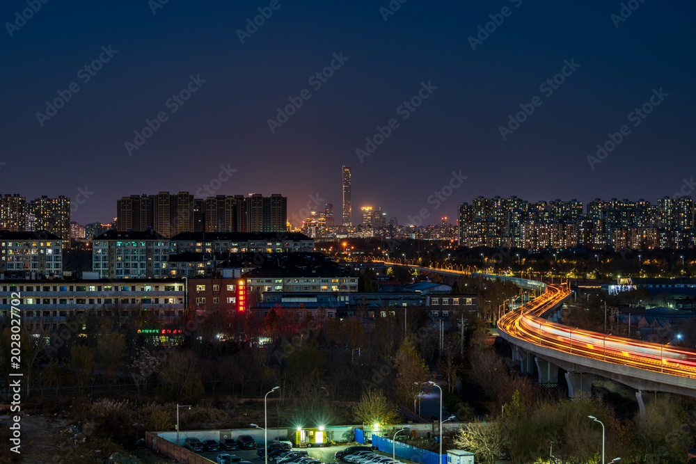 Fototapeta premium China Blues Moment: Commuter traffic at Jiugong Station on Beijing's Yizhuang Line; Distant view of the CBD and the skyline of China Zun.