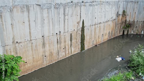 Aerial View of Drainage Pipe Discharging dirty water into Polluted Canal