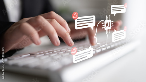 Fotografie A close-up view of hands typing on a keyboard with conceptual AI graphics