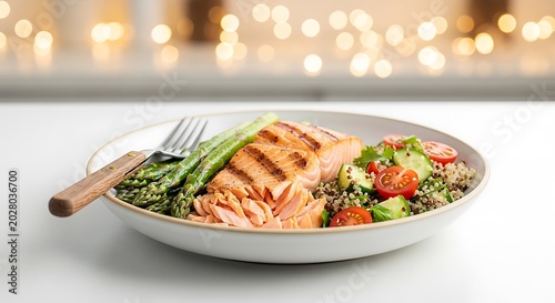 Grilled Salmon Fillet Served with Asparagus and Quinoa Salad on White Plate