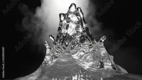 Mesmerizing Black and White Water Fountain Displays Dynamic Fluid Motion Against a Dark Background