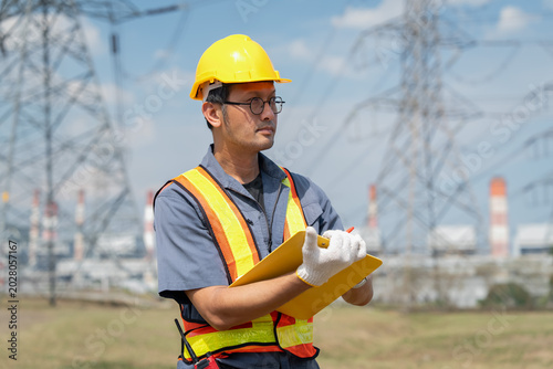 Safety inspection action by utility worker power plant photo outdoor close-up workplace safety