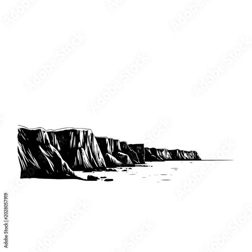 Fotografia A serene silhouette of a rugged sea coastline with steep cliffs and rocky shores against a calm ocean, evoking a sense of peacefulness and natural beauty at sunset