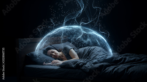 Woman rests in bed under a shimmering blue light dome that symbolizes optimal sleep quality and physiological restoration during the night within a quiet and dark residential bedroom interior.