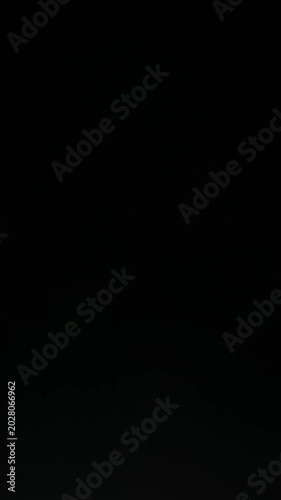 Sun glare, lens flare on a black background for transition to video. Colored rays. Stylish effects for video