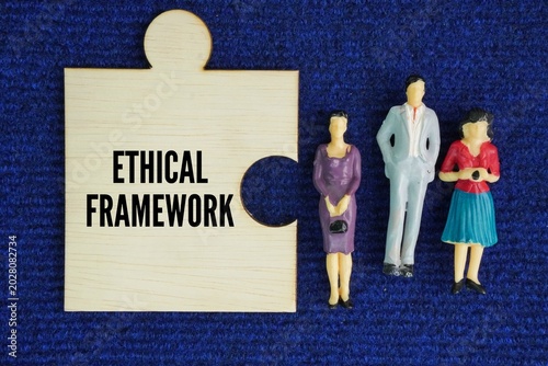 Miniature people and wooden puzzle with the word Ethical Framework. structured set of moral principles and guidelines used to evaluate situations, resolve ethical dilemmas, and make informed, morally 