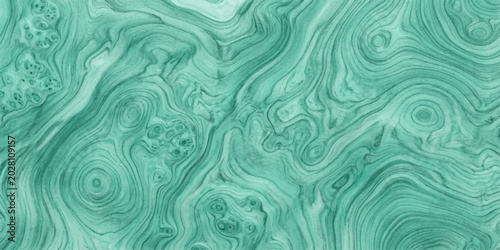 Foto A swirling pattern of malachite green mineral with intricate, organic lines and textured wood grain effect, creating a visually captivating and luxurious abstract background