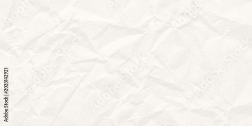 Photos Crumpled white paper texture background with creases and folds