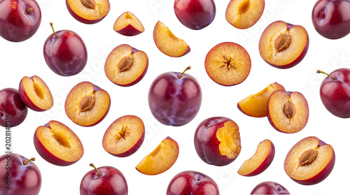 Cuadro en lienzo Assortment of fresh organic purple plums, whole, halved, and sliced, isolated on a transparent background