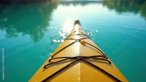 kayak paddle cutting turquoise lake surface