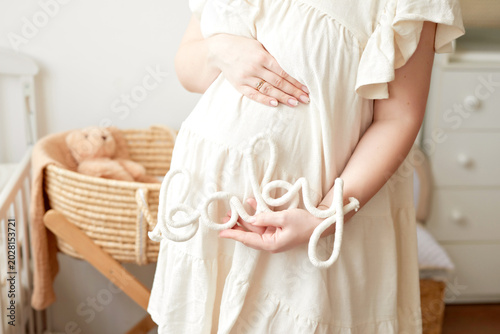Pregnant Mother With Daughters In Kids Room