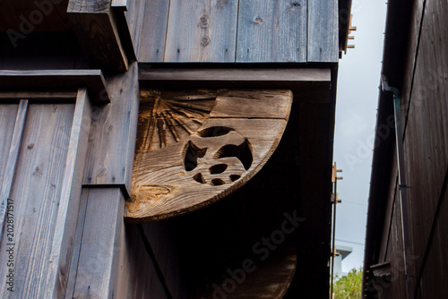 Wood carving detail on traditional wooden building in Shukunegi, Japan
