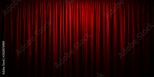 Red velvet stage curtain background with dramatic theater lighting and cinematic abstract fabric texture