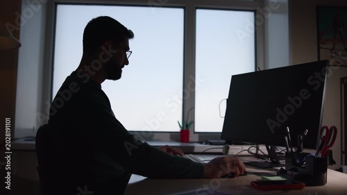 Person Working Diligently. Male Professional Typing On Keyboard Amidst Organized Workspace Environment. Media