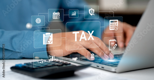 Canvastavla Business professionals are using calculators and reviewing tax documents to plan their finances in the office, with icons displayed on a digital screen