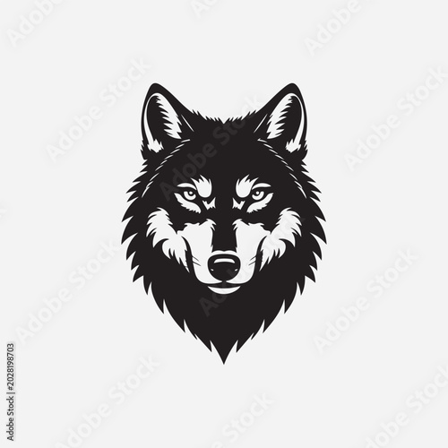 Aggressive wolf head mascot logo design featuring a stylized monochrome vector illustration of a fierce canine face for sports team branding and creative graphics