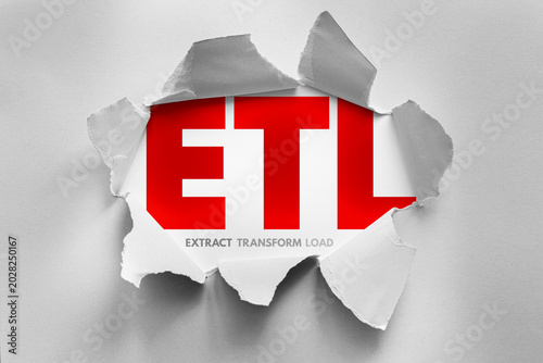 ETL extract transform load concept revealed through torn paper design, data processing workflow illustrating integration, analytics preparation, database management and structured information pipeline
