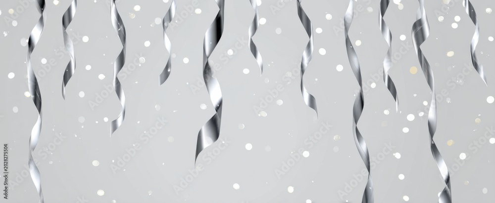 Fototapeta premium Shiny silver confetti with hanging glitter ribbons perfect for elegant celebration invites and festive banners