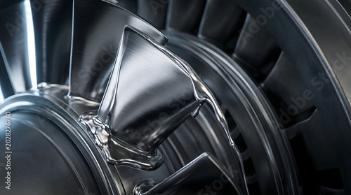 Close-up of jet engine turbine blades with turbine wheel, aviation technology