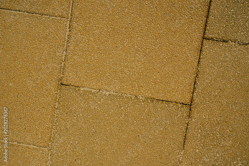 Aesthetic geometric background of textured outdoor rubber mat pavement, perfect for construction