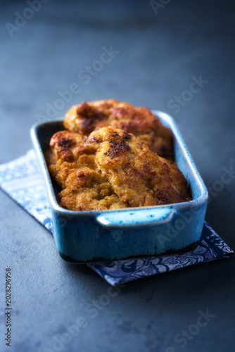 Fried chicken breast on a stone background. Soft focus.